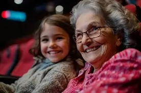 Grandmother & Grandaughter At Movie